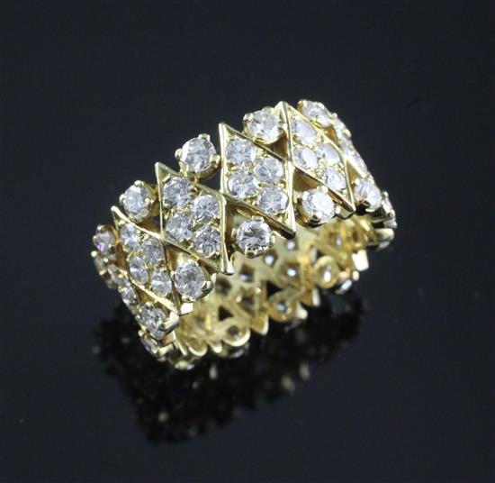 A David Morris? modern pierced gold and diamond encrusted eternity band, size N.